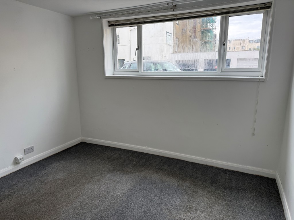 Lot: 135 - TWO-BEDROOM FLAT JUST OFF THE SEAFRONT - Front main bedroom with window